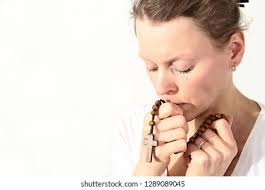 Woman Praying God Holy Cross Her Stock Photo 1289089045