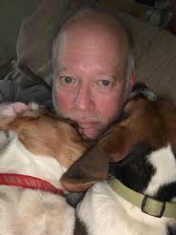 Beagles joining owners for a nap