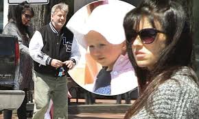 Alec Baldwin and pregnant wife Hilaria coo over daughter Carmen during  family outing