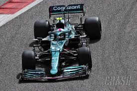 Window shop with car and driver. Vettel Reveals James Bond Inspired Name For 1st Aston Martin F1 Car