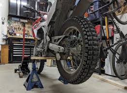Most professional motorcycle mechanics wouldn't do without a motorcycle lift but they're also a very handy bit of kit for the home mechanic. Anyone Use An Automotive Jack As A Bike Lift Stand General Dirt Bike Discussion Thumpertalk