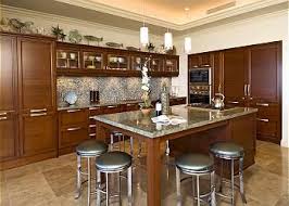 It includes two shelves for storage, along with some faux drawers. Kitchen Islands With Seating For 6 Kitchen W Gourmet Appliances Island Seatin Kitchen Island With Seating Kitchen Layout Kitchen Island With Seating For 6