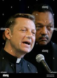 Father Michael Pfleger of Saint Sabina Catholic Church joins the Reverend  Jesse Jackson