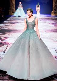 This Fashion Forward Gown From Michael Cinco Featuring Fairy Tale Inspired Colors And Shimmering Details Is Exceedingly Beautiful Gowns Fancy Dresses Dresses