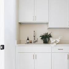 white cabinets with cream countertops