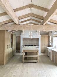 The beam above the fireplace has been stained to an almost black hue. Painting Wooden Beams Earthborn Paints