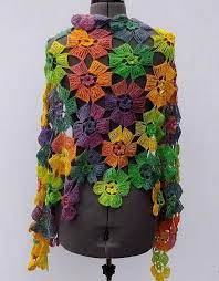 This crochet pattern for a delicate triangle shawl will be an elegant addition to every wardrobe. Crochet Pattern Flower Wrap Shawl Crochet Shawls Crochet Shawls And Wraps Shawl Crochet Pattern Crochet Flower Patterns