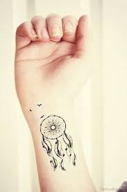 How about something with a modern motif, such as this owl henna tattoo design? 50 Wonderful Dreamcatcher Tattoos On Wrist