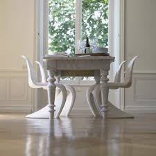Verner Panton S Iconic Panton Chair Is A Marvel Of Modern Design And Manufacturing And It Holds Its Own White Dining Chairs Dining Table Marble Modern Chairs