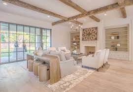Updated Steel Doors And Wide Plank Reclaimed Wood Floors And Beams Make This Home By Elizabeth Garrett Interior Luxe Living Room Family Room Design Family Room