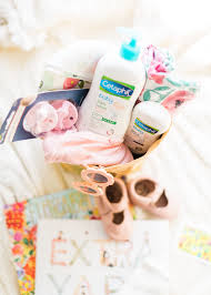 Diy diaper cake tutorial ~ a great tutorial on how to build your own diaper cake. How To Put Together The Cutest Diy Baby Shower Gift Basket Glitter Inc