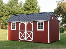Red Painted Wooden Storage Building With A Black Metal Roof Shed Shed Design Wooden Storage Buildings