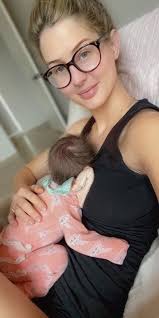 Mum, dad, and a furry big sister with little miss Adeline