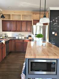 We compared costs of kitchen cabinets and assembled kitchen cabinets. Building Cabinets Up To The Ceiling Thrifty Decor Chick