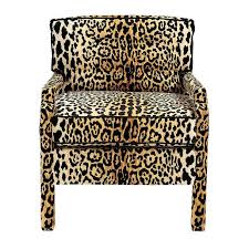Chic work space boasts a leopard print chair in tonic home bianca fabric lined with an eastern charms hibiscus pillow paired with a salvaged wood desk topped with a yellow green lamp. Snow Leopard Kerri Upholstered Barstool
