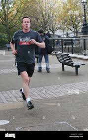 David Cameron going for a jog along the South Bank London, England