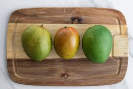 In this video, you'll learn how to cut and peel a mango—you'll see two great techniques for removing the peel and seed, and discover the best way to cut them into cubes without removing the skin. How To Properly Cut A Mango Healthy Fitness Meals