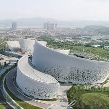 Pes Architects Used Custom Developed Ceramic Tiles And Louvres To Create The Curving Lines Of T Futuristic Architecture Concept Architecture Circular Buildings