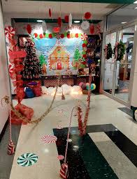 Match your garland accessories to wall art and decor throughout the space rather than using the classic christmas colors for an understated yet festive look. The Elm Holiday Door Decorating Contest Photos Locations And Winners