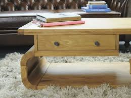Coffee table with rustic oak wooden top and peppercorn metal frame. Contemporary Curved Oak Coffee Table Greenway Furniture