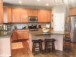 You can attach using short nails, but for doors that are thin, you want to use a strong adhesive. Kitchen Island Makeover Bella Tucker