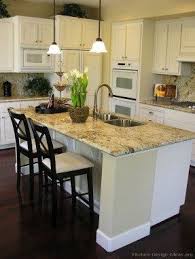 If the counter space is large, it may either be designed as a full dining space or may be divided as a prep area with a sink or a cooktop. Kitchen Island With Granite Top And Breakfast Bar Ideas On Foter Traditional White Kitchen Cabinets White Kitchen Traditional Kitchen Island With Granite Top