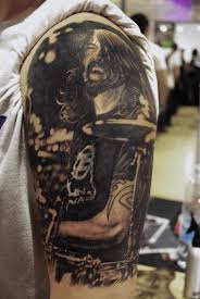 Large sections of scripture and literature go well on the chest and can be accompanied by other images as well. Dave Grohl Black And Grey Tattoo Portrait Music Tattoo Designs Grey Tattoo Black And Grey Tattoos