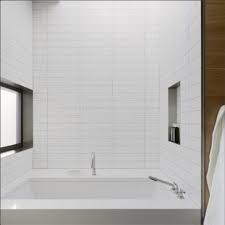 A background of vibrant yellow tiles framed by cream subway tiles is a guaranteed way to make a sunny statement in the bathroom. Tile Design Archives Gio Tile