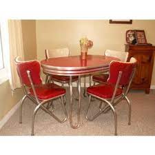 The is a retro table, chairs, coffee cup and coffee percolator. Retro Kitchen Table And Chairs You Ll Love In 2021 Visualhunt