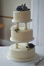 3 Tier Wedding Cake With Pillars Hand Piped Lace And Hand Made Sugar Flowers By Www Tortebella C Wedding Cakes Vintage Tiered Wedding Cake Wedding Cake Plates