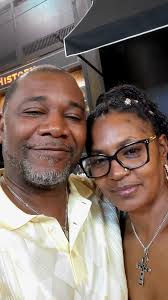 Ross LaGrandeur presents Stew Moore with his Class of 1980 Challenge Coin  as they both model the new Class of 1980 hat, which will be distributed at  Reunion Weekend, so make sure