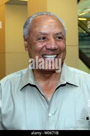 Former St. Louis Hawks point guard and head basketball coach of the Atlanta  Hawks Lenny Wilkens (R) says hello to friend Jack Levitt during a reunion  of od Hawks team members in
