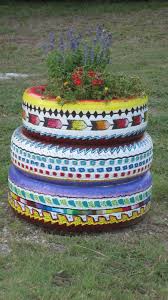 Painted And Stacked Old Tires Painted With Acrylic Paint And Sprayed With A Clear Sealer Creative Gardening School Garden Hanging Baskets