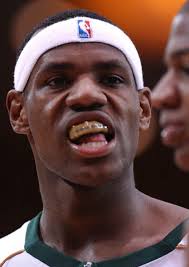 St. Vincent-St. Mary's LeBron James (L) eyes opponent, Mater Dei's D.J.  Strawberry, during their game in Los Angeles, CA, 04 January 2003. St.  Vincent-St. Mary won 64-58 with James scoring 21 points.