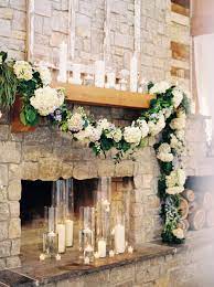 Greenery Garland On Our Grand Fireplace With An Abundance Of Pillar And Floating Candl Floating Candles Wedding Wedding Fireplace Decorations Wedding Fireplace