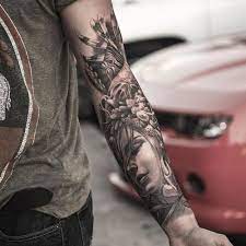 This tattoo includes a black inked skull face that fits on your arm and black outlined roses with red ink inside. 51 Best Forearm Tattoos For Men Cool Design Ideas 2021 Guide
