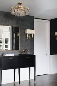 Black And Gold Rectangular Wall Mirror Beautifully Styled Contemporary Black Foyer Features A Rectangular Gold Mirror Mounted To A Wall Half Cover Grey And Gold Bedroom Foyer Colors Foyer Decorating