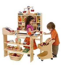 Salones recreativos discovery kids juegos antiguos. Minus The Conveyor Belt This Setup Has A Godsey S Store Feel Also Without That Pesky Corabeth Walton Godsey Bein Crate Furniture Kids Furniture Kids Market