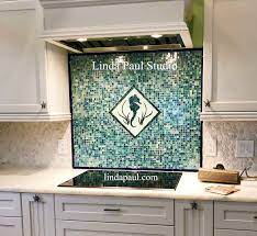 Discover how a metal tile kitchen backsplash can provide a stylish, functional addition to your cooking space. Seahorse Tile Ocean Inspired Seashell Glass Accent