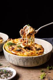 Roasted Garlic Spaghetti Squash Lasagna Boats Half Baked Harvest Recipe In 2020 Half Baked Harvest Recipes Garlic Spaghetti Spaghetti Squash Lasagna