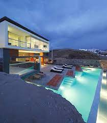 The tranquil sound of lapping waves, the beauty of sunsets over (image via: Contemporary Two Story Stone Beach House