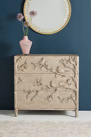Furniture carved by hand, no matter the skill of the craftsman, will show ever so slightly a difference between similar parts, i.e. Handcarved Ornithology Three Drawer Dresser Anthropologie