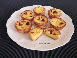 A pastel de nata is a portuguese custard tart made with puff pastry and filled with egg custard that is served with a dusting of powdered sugar and a pinch of cinnamon. Celebration In My Kitchen Goan Food Recipes Goan Recipes Portuguese Egg Tarts Pasteis De Nata Pastel De Nata Goan Pasteis De Nata