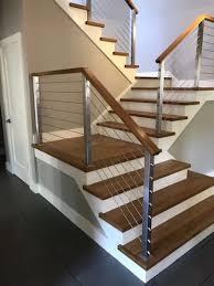 A homeowner in the boystown neighborhood of chicago was looking to remodel their home and incorporate sleek and contemporary handrails for two of their interior staircases. Contemporary Railings Stairs Fabrication Merrimack County Customs