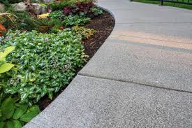The sand in a paver patio acts like glue. Choosing The Right Concrete Finish Pacific Garden Design