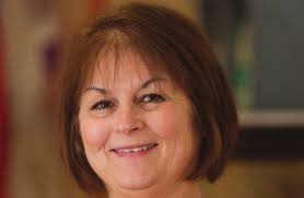 OUTSTANDING ALUMNA GRETCHEN WOLLERT McLENNON '93