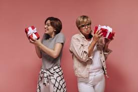 46 gifts for older ladies ranked in order of popularity and relevancy. Free Photo Happy Girl With Short Hair Holding Gift Box Rejoicing And Posing With Stylish Surprised Old Lady In White Outfit On Isolated Backdrop