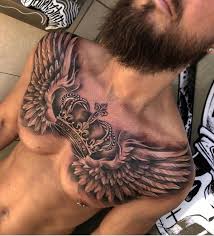 Grey ink winged hourglass tattoo. Best Chest Wings Tattoo Idea