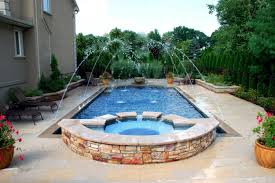 Deck jet water features can be cast into concrete decks and gunite pool walls, or mounted into surrounding poolscapes. 50 Spectacular Swimming Pool Water Features
