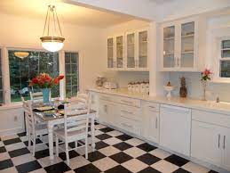 A modern kitchen with white slab front cabinets, chrome hardware and walnut flooring and accents. White Glass Cabinet Doors Houzz